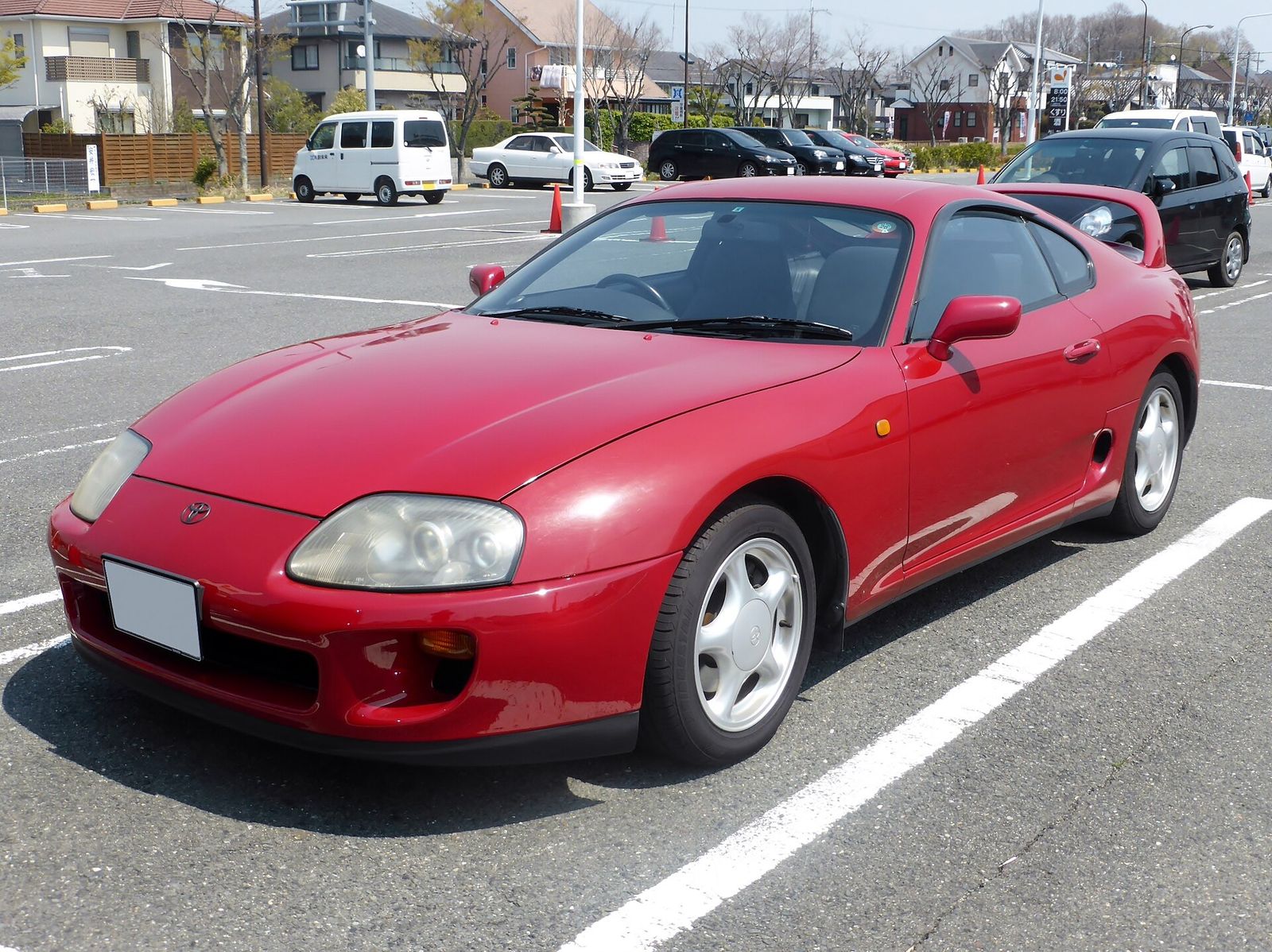 Red Toyota Supra in a Japanese car park